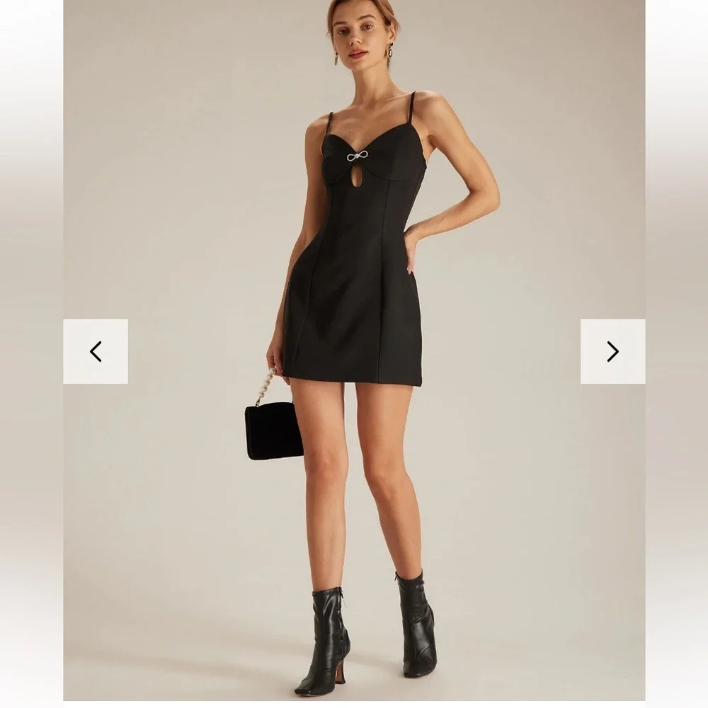 The Black V Neck Cutout  Sleeveless Mini Dress size med LBD sexy rhinestone bow